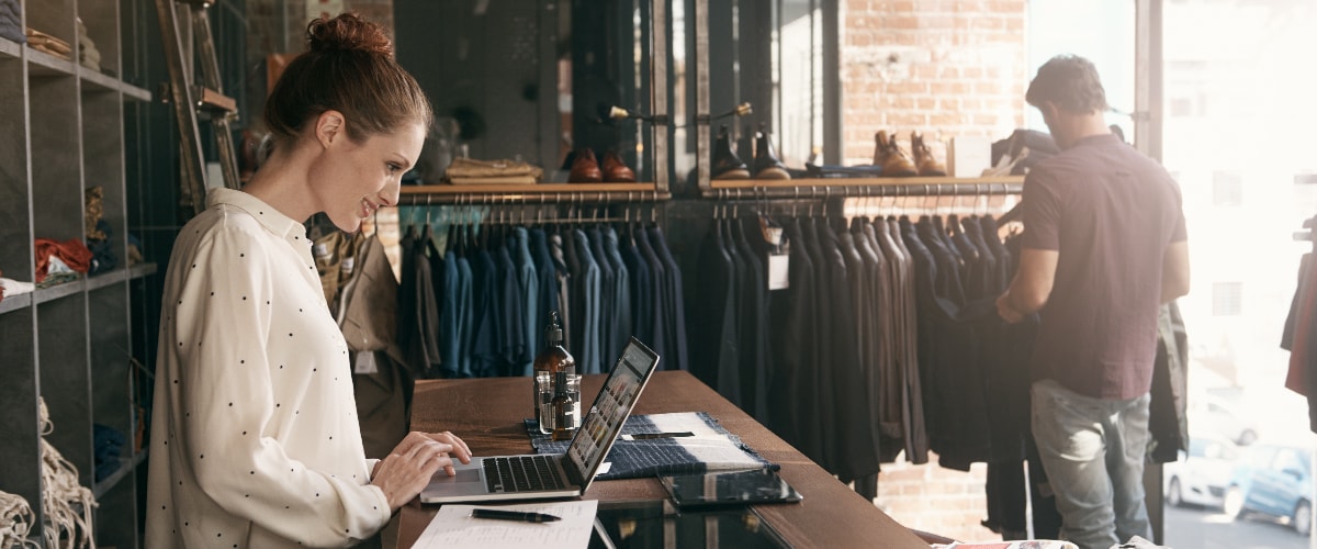 Key Trends | Apparel Store Clerk on Laptop