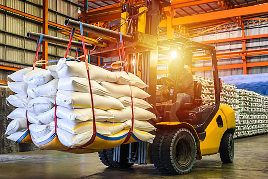 Forklift Transporting Bags of Rice